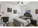 Comfortable bedroom with unique headboard, desk, and neutral decor at 13215 Beechberry Dr, Riverview, FL 33579