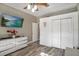 Bright bedroom with wood floors, neutral walls, and plenty of closet space at 13215 Beechberry Dr, Riverview, FL 33579