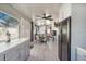 Inviting Florida room featuring tile flooring, ceiling fans, and a dining area with an outdoor view at 13215 Beechberry Dr, Riverview, FL 33579