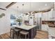Bright kitchen with white cabinetry, stainless steel appliances, and an island with seating at 13215 Beechberry Dr, Riverview, FL 33579