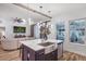 Open kitchen featuring a large island with quartz countertops, a farmhouse sink, and modern pendant lighting at 13215 Beechberry Dr, Riverview, FL 33579