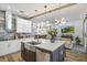 Modern kitchen with an island, stainless steel appliances, and an open layout at 13215 Beechberry Dr, Riverview, FL 33579