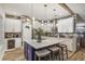 Stunning kitchen features a large island with seating, modern appliances, and stylish pendant lighting at 13215 Beechberry Dr, Riverview, FL 33579