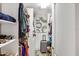 Well-organized walk-in closet with built-in shelving and ample storage space at 13215 Beechberry Dr, Riverview, FL 33579