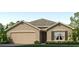 Charming one-story home featuring a two-car garage, landscaped front yard, and a neutral stucco exterior at 1430 Brown Mallet Pl, Ruskin, FL 33570
