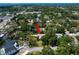 Discover the home from above, surrounded by mature trees and located in a vibrant neighborhood with nearby waterfront views at 1431 Normandy Ln, Palm Harbor, FL 34683