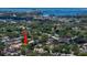 Located in a suburban neighborhood near an urban center, discover your home surrounded by mature trees and lush landscaping at 1431 Normandy Ln, Palm Harbor, FL 34683
