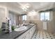 Bathroom with dual sinks, a large mirror, and decorative accents at 1431 Normandy Ln, Palm Harbor, FL 34683
