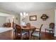 Dining room featuring a wood table, chandelier, and classic decor at 1431 Normandy Ln, Palm Harbor, FL 34683