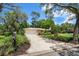 Charming single-story home boasting lush landscaping, an attached two car garage, and a brick mailbox at 1431 Normandy Ln, Palm Harbor, FL 34683
