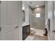 Bathroom features a stylish vanity and a shower with decorative tile at 14421 Swiss Bridge Dr, Lithia, FL 33547