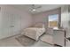 Charming bedroom with soft pink walls, plush bedding, and natural light creates a cozy and inviting retreat at 14421 Swiss Bridge Dr, Lithia, FL 33547