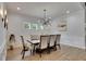 Bright dining room features modern lighting, wainscoting, and elegant decor at 14421 Swiss Bridge Dr, Lithia, FL 33547