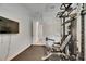 Private gym includes various exercise machines for a comprehensive workout experience at 14421 Swiss Bridge Dr, Lithia, FL 33547