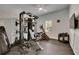 Well-equipped exercise room with ample workout machines, free weights, and rubber flooring at 14421 Swiss Bridge Dr, Lithia, FL 33547