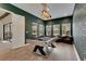 Elegant game room features a modern pool table, windows for natural light, and a stylish brick accent wall at 14421 Swiss Bridge Dr, Lithia, FL 33547