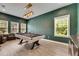 Inviting game room boasts a stylish pool table and great lighting, perfect for entertaining guests at 14421 Swiss Bridge Dr, Lithia, FL 33547