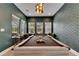 Spacious game room with a well-lit pool table, comfortable seating, and ample natural light at 14421 Swiss Bridge Dr, Lithia, FL 33547