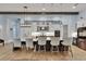 Modern kitchen with sleek countertops, stainless appliances, and stylish bar seating at 14421 Swiss Bridge Dr, Lithia, FL 33547