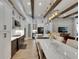 Gourmet kitchen with granite countertops, stainless appliances, and open to the living area at 14421 Swiss Bridge Dr, Lithia, FL 33547