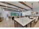 Open kitchen with marble island, modern lighting, and an inviting connection to the living space at 14421 Swiss Bridge Dr, Lithia, FL 33547
