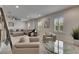Relaxing living space with white brick walls, comfortable seating, and natural light from shuttered windows at 14421 Swiss Bridge Dr, Lithia, FL 33547