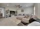 Comfortable living room with sectional seating, shelving, and a modern TV setup at 14421 Swiss Bridge Dr, Lithia, FL 33547