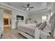 Spacious main bedroom features tray ceiling, a ceiling fan, and adjoining bathroom with walk-in closet at 14421 Swiss Bridge Dr, Lithia, FL 33547