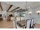 The dining room seamlessly connects to the living room, creating a spacious and inviting atmosphere at 14421 Swiss Bridge Dr, Lithia, FL 33547
