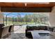 This patio features an outdoor living area, dining table, stone flooring, and pool with screen enclosure at 14421 Swiss Bridge Dr, Lithia, FL 33547