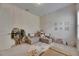 Well-organized playroom with cozy seating area and creative storage solutions for toys and books at 14421 Swiss Bridge Dr, Lithia, FL 33547