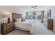 Bright main bedroom featuring a neutral color palette, large windows, and stylish furnishings at 1462 Brown Mallet Pl, Ruskin, FL 33570