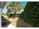 Private backyard featuring lush landscaping and mature trees, creating a peaceful outdoor retreat at 1601 Fluorshire Dr, Brandon, FL 33511