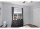 Bedroom with a window, dark dresser and hardwood flooring at 1601 Fluorshire Dr, Brandon, FL 33511