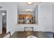 Modern kitchen overlooking the dining room, complete with stainless steel appliances and wooden cabinetry at 1601 Fluorshire Dr, Brandon, FL 33511