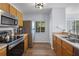 Functional kitchen featuring stainless steel appliances, wood cabinets, and lots of counter space at 1601 Fluorshire Dr, Brandon, FL 33511