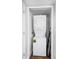 An in-unit laundry closet with a stacked washer and dryer unit for efficient space-saving laundry solutions at 1601 Fluorshire Dr, Brandon, FL 33511