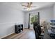 Bright office space with a ceiling fan, hardwood flooring and large window at 1601 Fluorshire Dr, Brandon, FL 33511