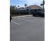 Well-maintained parking area near a charming building with neat landscaping, convenient for residents and guests at 1601 Fluorshire Dr, Brandon, FL 33511