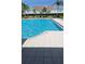 Enjoy the community pool with ample seating; a perfect space for relaxation and socializing at 1601 Fluorshire Dr, Brandon, FL 33511