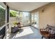 Inviting screened porch with comfortable chairs, offering a perfect spot to enjoy the outdoors in comfort at 1601 Fluorshire Dr, Brandon, FL 33511