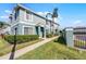 Inviting exterior of a two-story townhome with lush landscaping, creating curb appeal and charm at 1601 Fluorshire Dr, Brandon, FL 33511