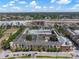 An aerial view of the complex showcasing the pool and community layout with surrounding cityscape at 1810 E Palm Ave # 5114, Tampa, FL 33605