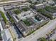 Aerial view of the complex featuring a rooftop pool and parking at 1810 E Palm Ave # 5114, Tampa, FL 33605