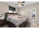 Comfortable bedroom featuring a queen bed and modern mirror at 1810 E Palm Ave # 5114, Tampa, FL 33605