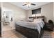 Cozy bedroom with dark furniture, comfortable bed, and a view to the office at 1810 E Palm Ave # 5114, Tampa, FL 33605