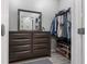 Walk-in closet with a well-organized clothing rack and mirror on dresser at 1810 E Palm Ave # 5114, Tampa, FL 33605