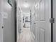 Hallway featuring access to the bathroom, walk-in closet, and other rooms at 1810 E Palm Ave # 5114, Tampa, FL 33605