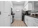 Efficient kitchen with white cabinetry and appliances, including a modern range at 1810 E Palm Ave # 5114, Tampa, FL 33605