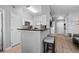 Contemporary kitchen with stainless steel appliances, a breakfast bar, and sleek white cabinetry at 1810 E Palm Ave # 5114, Tampa, FL 33605